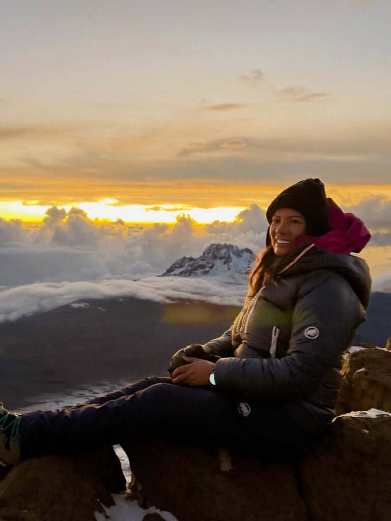 sunrise from the top of kilimanjaro unreal. standing above the clouds as the first light touches the earth golden skies endless horizons silence everyw(