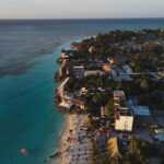 Which Tanzania Safari Is Best for You? Stunning aerial photograph of Nungwi Beach, Zanzibar capturing the serene coastline at sunset.